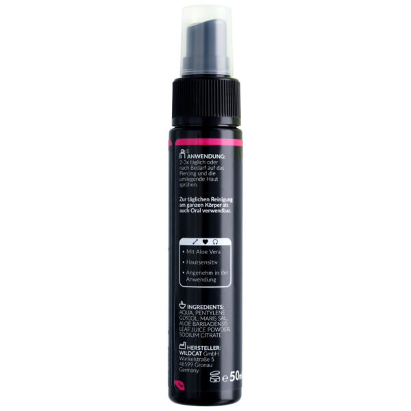 Spray negro para piercings con letras blancas y rosas, botella de 50 ml