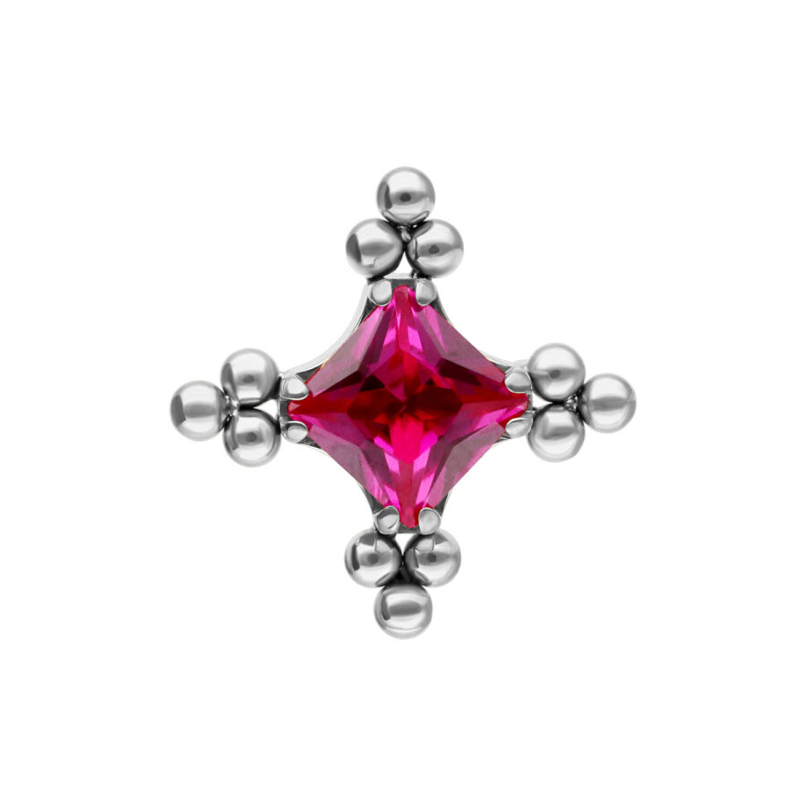 Accesorio plateado con cristal rojo rubí y patrón de burbujas sobre fondo blanco