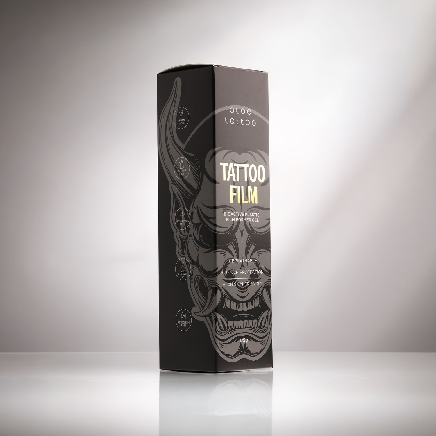 Empaque negro del Aloe Tattoo Tattoofilm con diseño decorativo en superficie reflectante