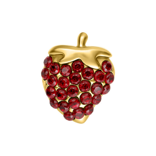 Adorno de fresa dorado con piedras rojas sobre fondo blanco