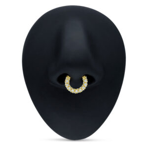 Clicker de Septum Dorado con cristales claros sobre fondo negro