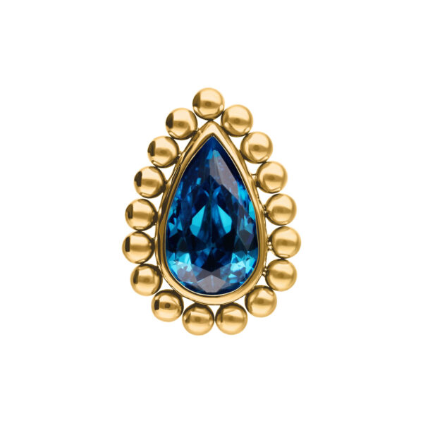 Ajuste en forma de gota dorada con cristal turquesa, rodeado de bolas doradas