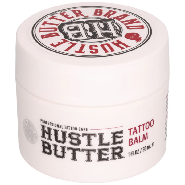 Bote blanco de Hustle Butter Tattoo Bálsamo con texto rojo y negro sobre fondo blanco